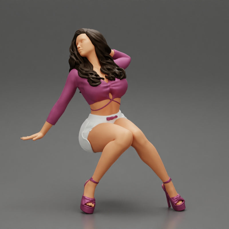 Young sexy girl in shorts with long hair is sitting with one hand in hair - Only-Games