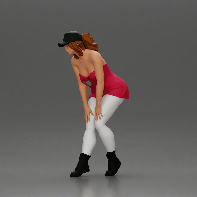 beautiful woman placing her hand on her legs, wearing a cap and a bra top - Only-Games