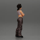 A chola girl with curly hair standing in large pants with crossed hands - Only-Games