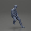 man sitting on a car, wearing a jacket and sunglasses, deep in thought - Only-Games