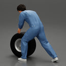 Mechanic worker walking and rolling tyre - Only-Games