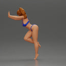 Woman in a bikini leaning on the car with her hands on the beach - Only-Games