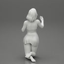 Sexy girl in mini dress with short hair sitting on her knees - Only-Games