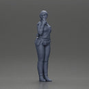 policewoman standing hand resting on her back speaking into a radio with short hair - Only-Games