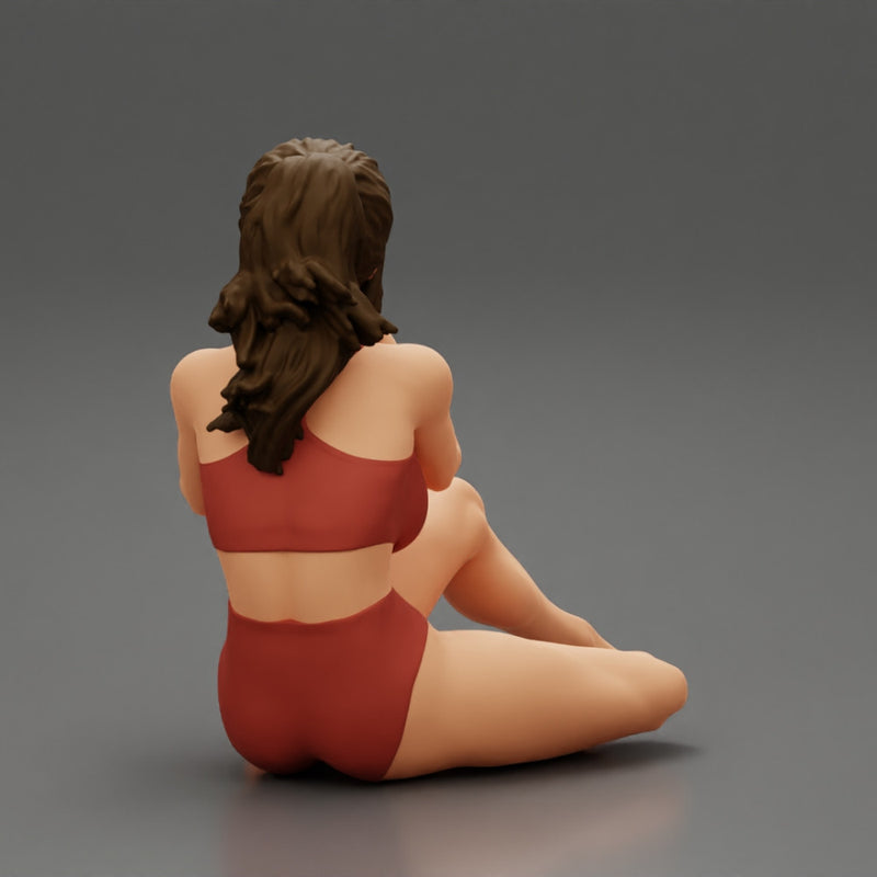 Woman photographer in bikini sitting and holding a camera - Only-Games