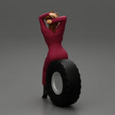 2 Models - SEXY GIRL MECHANIC IN SUIT SITTING ON A TRUCK TYRE AND HANDS IN HAIR - Only-Games