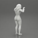 Travel woman in short pointing her next destination using world map - Only-Games