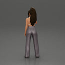 Stylish woman in a crop top and pants, standing thoughtfully - Only-Games