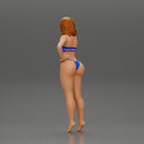 sexy girl in bikini standing smoking cigarette on the beach - Only-Games
