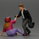 motorbike rider holding a helmet helps a biker girl, who fell off the bike, stand up - Only-Games