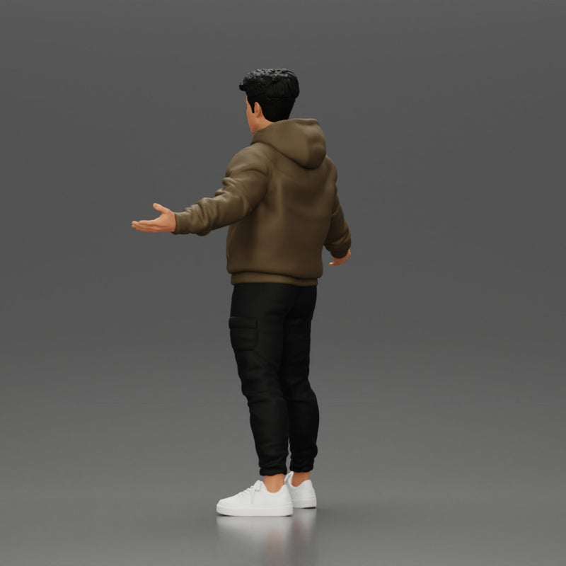 Asian Man Standing in Hoodie with Raised Hands