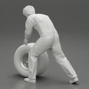 Mechanic worker walking and rolling tyre - Only-Games