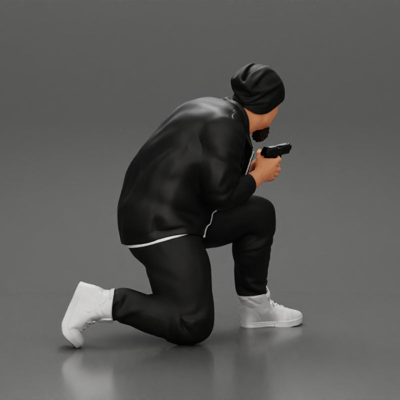 Gangster in hat and jacket sitting and holding a gun hides behind the car - Only-Games