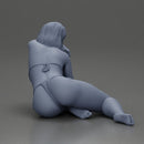 attractive girl in a bikini, lying and reclining gracefully on the beach - Only-Games