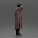 old man with pointed beard leaning against a wall in deep thought with his coat open - Only-Games