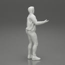 young man standing and explaining with hands - Only-Games