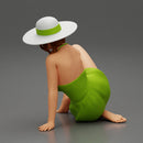 young woman in a summer suit and hat sitting - Only-Games