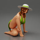 young woman in a summer suit and hat sitting - Only-Games