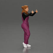Smiling girl in overalls showing a thumbs up with both hands - Only-Games