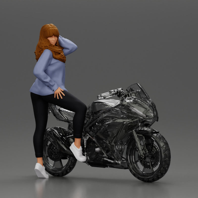 Young woman in  shirt with long hair posing with one foot resting on the motorcycle