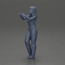 Smiling girl in overalls showing a thumbs up with both hands - Only-Games