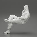 man in leather jacket and jeans sitting cross legged and thinking - Only-Games