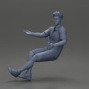 Man in shorts sitting explaining and holding a drink - Only-Games