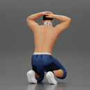 Gangster in mask and cap sitting putting his hands behind head about to be arrested - Only-Games