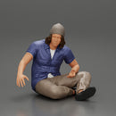 young man in a bonnet sitting crossing his legs and hugging a dog - Only-Games