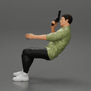 Gangster sitting at the table with a glass of whisky holding gun and playing poker - Only-Games