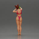 attractive woman in bikini taking a selfie with her phone on the beach - Only-Games