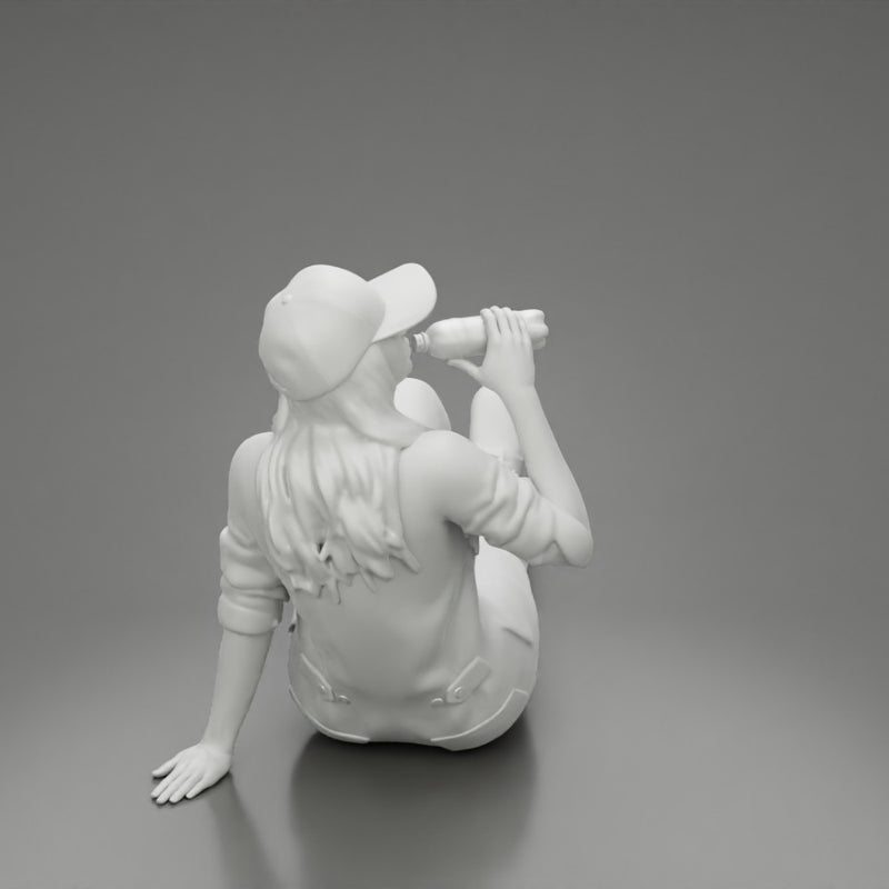 Tired woman mechanic in suit and cap sitting and drinking water during from bottle - Only-Games