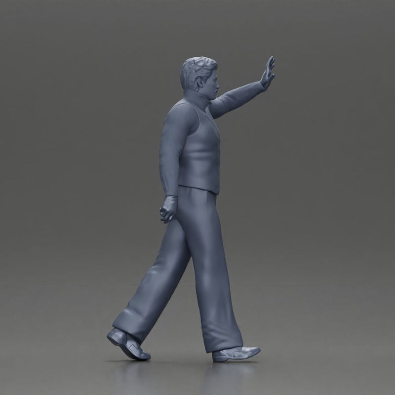 man in suit raising hand up walking