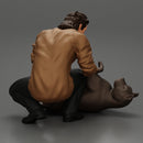 man sitting on the sidewalk and petting his dog - Only-Games