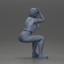 Sexy Girl in a Mini Leather Jacket and Shorts Sitting and Leaning with Her Hands - Only-Games