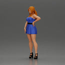 Confident Woman in Blue Dress Posing with Graceful Elegance - Only-Games