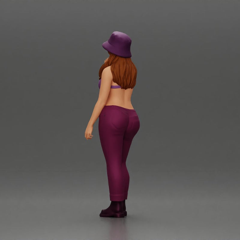 beautiful girl in pants and a hat thinking