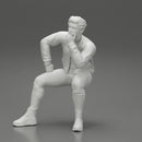 man in leather jacket sitting in thinking pose - Only-Games