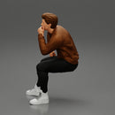 man in leather jacket sitting in thinking pose - Only-Games