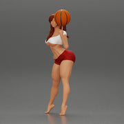 Sexy Young Sporty Girl Playing With the Ball on the Basketball - Only-Games