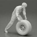 Mechanic worker walking and rolling tyre - Only-Games