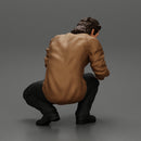 man sitting on the sidewalk and petting his dog - Only-Games