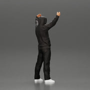 man in a hoodie supporting and holding a scarf - Only-Games