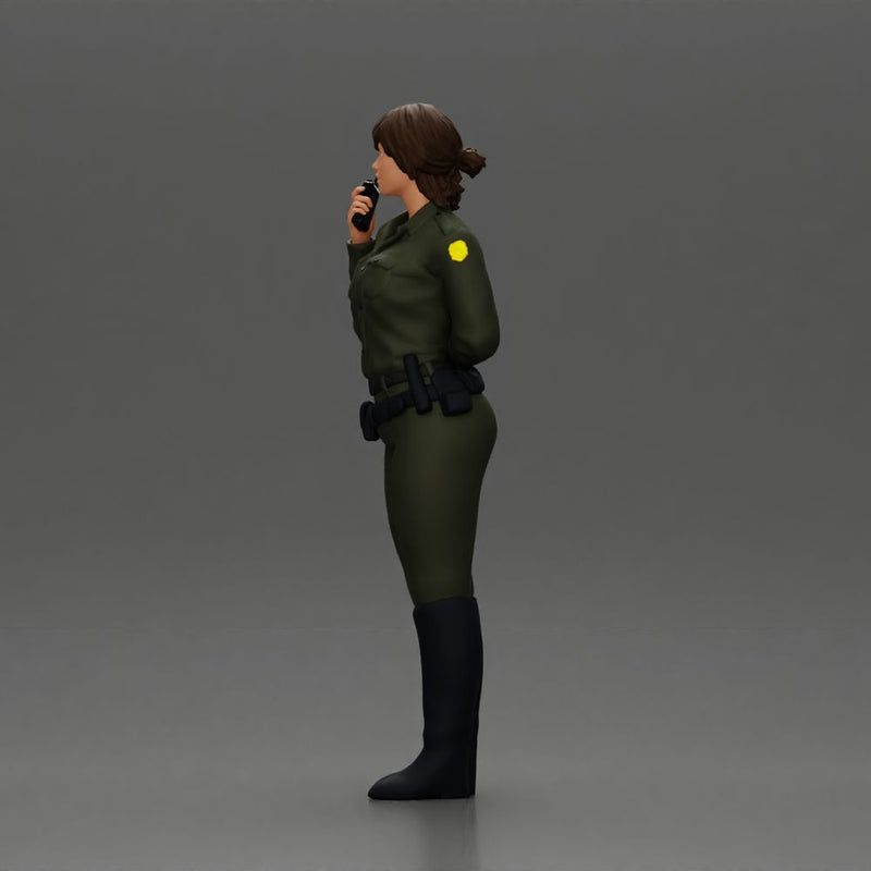 policewoman standing hand resting on her back speaking into a radio with short hair