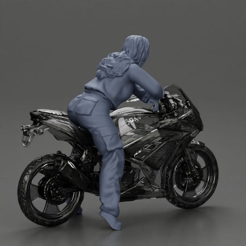 motorcyclist woman hoodie sitting on motorcycle