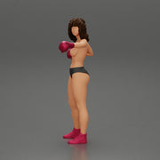 black naked breasts woman in boxing gloves with curly hair ready to finish off her opponent - Only-Games