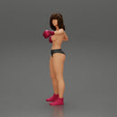 black naked breasts woman in boxing gloves with curly hair ready to finish off her opponent - Only-Games