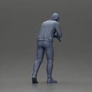 man in a hoodie leaning with his hands on the car - Only-Games