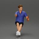 Man in shorts sitting explaining and holding a drink - Only-Games