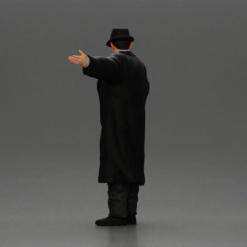 mafia man in gangster costume stands confidently while gesturing with his hands as if presenting something